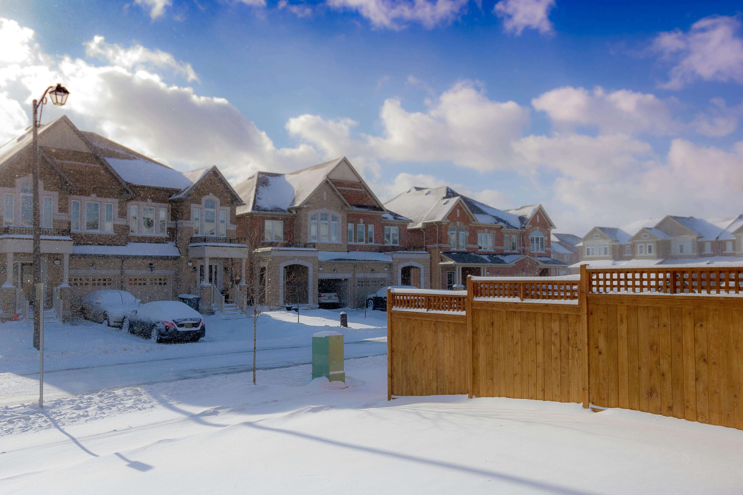 Snow-covered driveways in suburb.